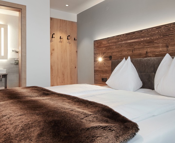 Gemütliches Bett in den Wieslbauer Appartements Flachau